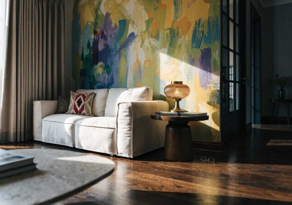 Living room furniture arranged facing a colorful accent wall