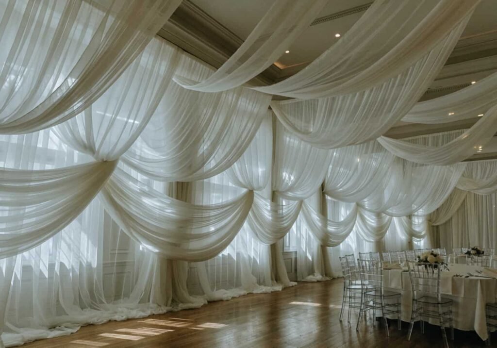 Draped fabric decoration creating an elegant wedding hall ambiance
