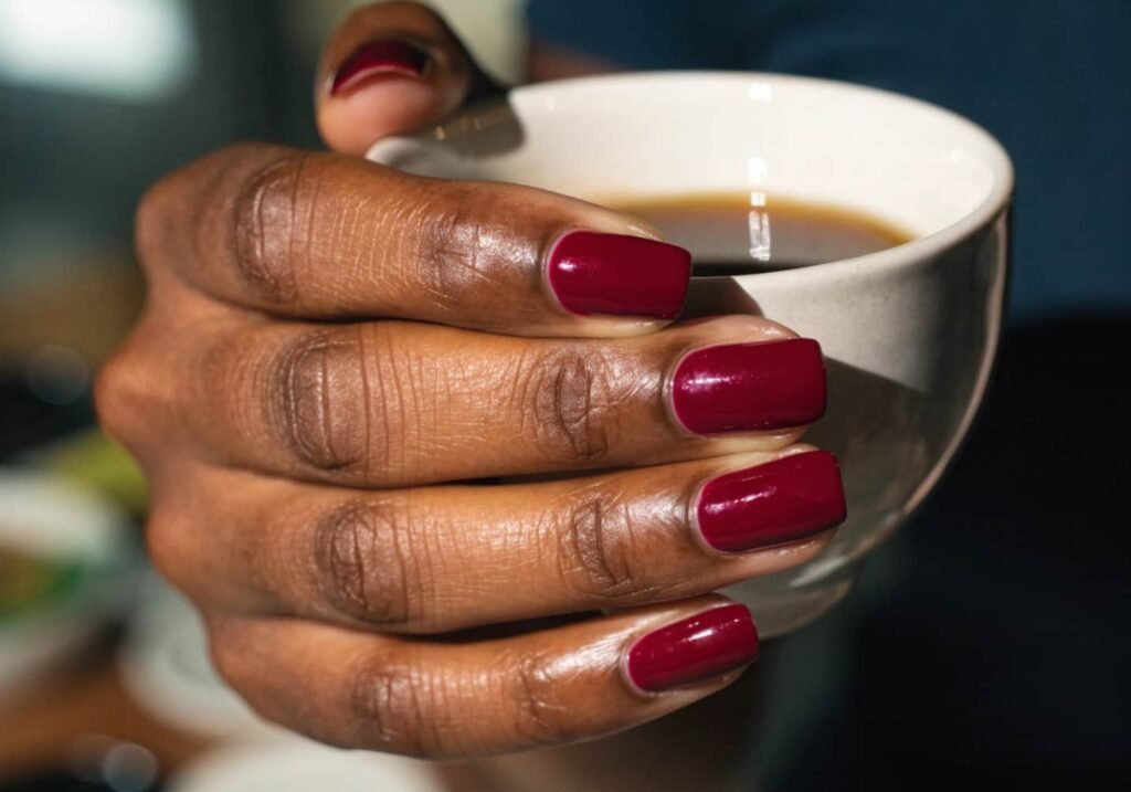 Short square nails with a glossy solid burgundy manicure