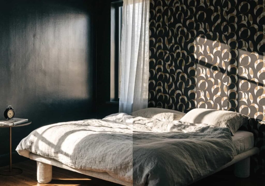 Comparison of black painted wall and black patterned wallpaper in a bedroom feature wall.