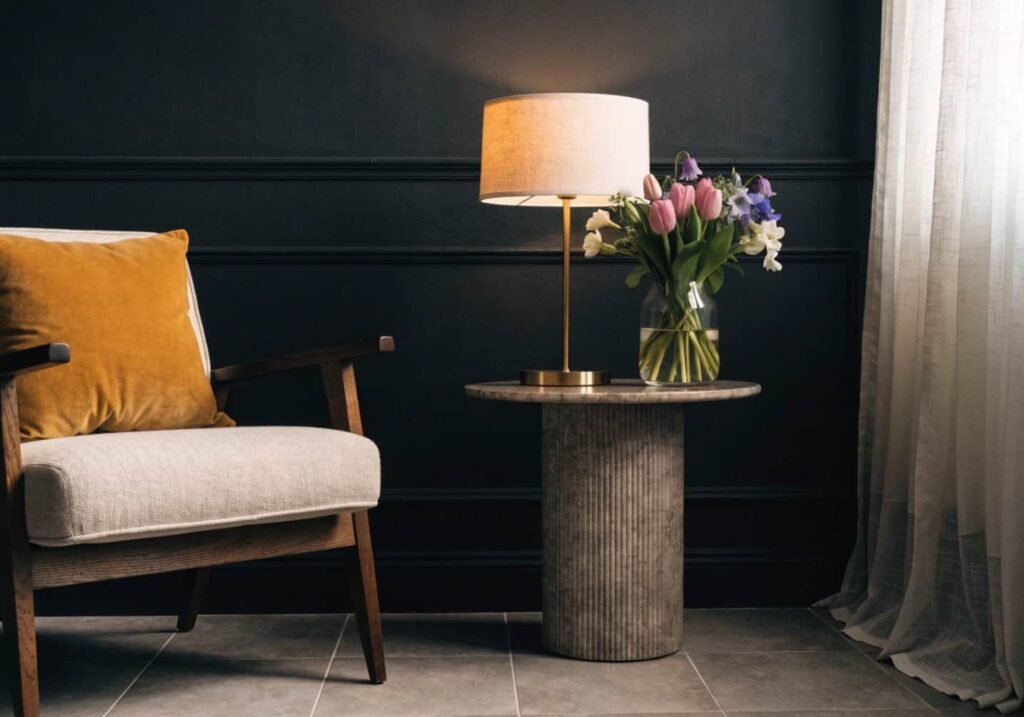 Black wall balanced with bright mustard and cream accents