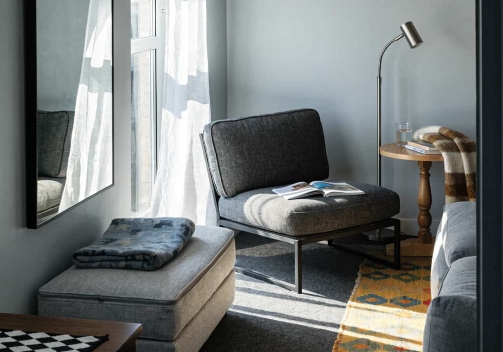 Small grey boho living room with warm layered styling