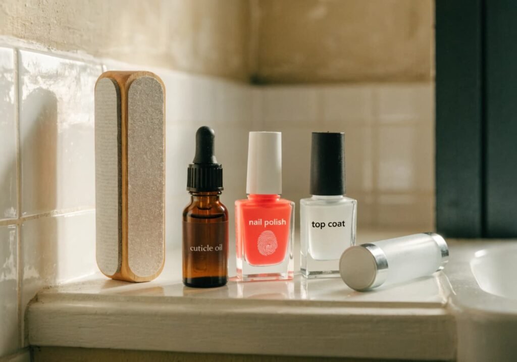 Must-have nail products for a classy at-home manicure including top coat and LED lamp
