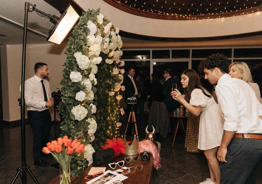 Floral photo booth corner set up for wedding guests