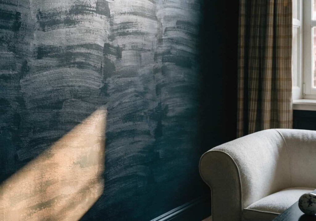 Dark charcoal living room wall showing undertone and depth under natural light