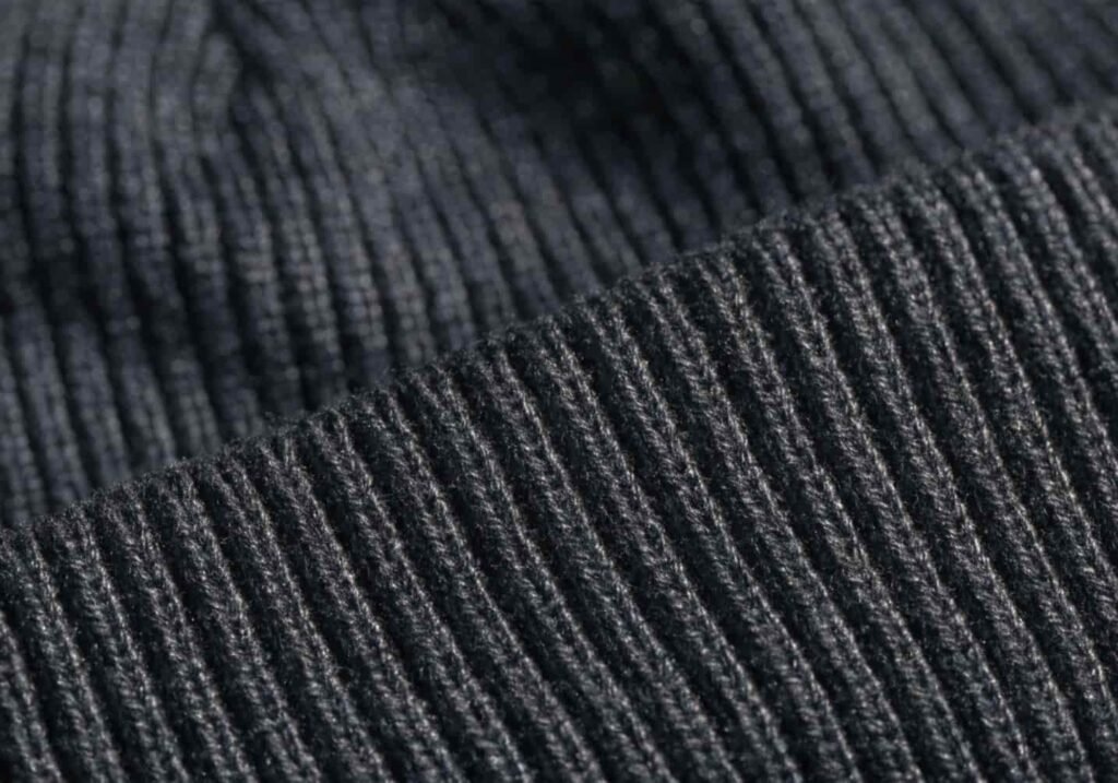 Close-up of tightly knit acrylic fabric on a Carhartt beanie
