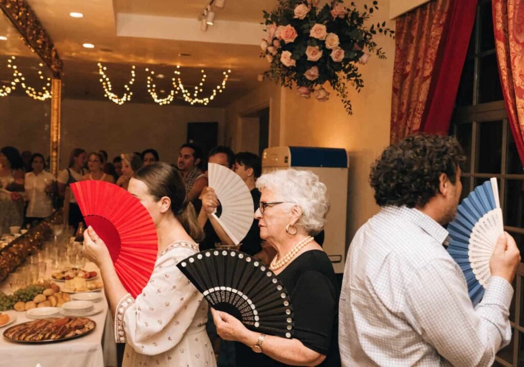 Standing cooling units placed near buffet area at an indoor wedding.