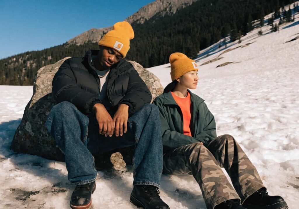 Man and woman both wearing Carhartt beanies, showing unisex fi