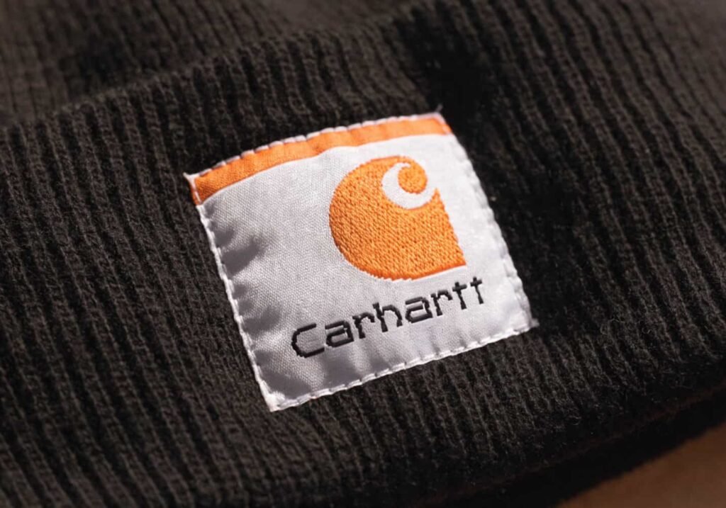 Close-up of authentic woven Carhartt logo patch on a beanie
