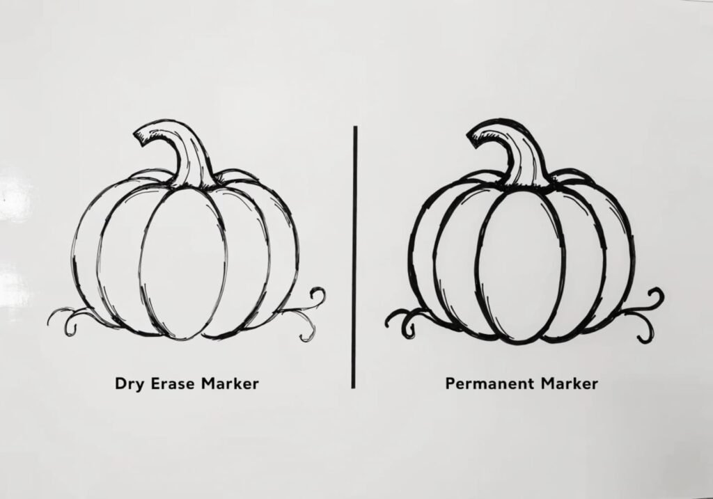 Comparison of dry erase versus permanent marker pumpkin drawings on a white board.
