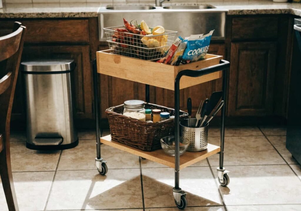 Rolling kitchen cart used as extra storage for snacks and spices