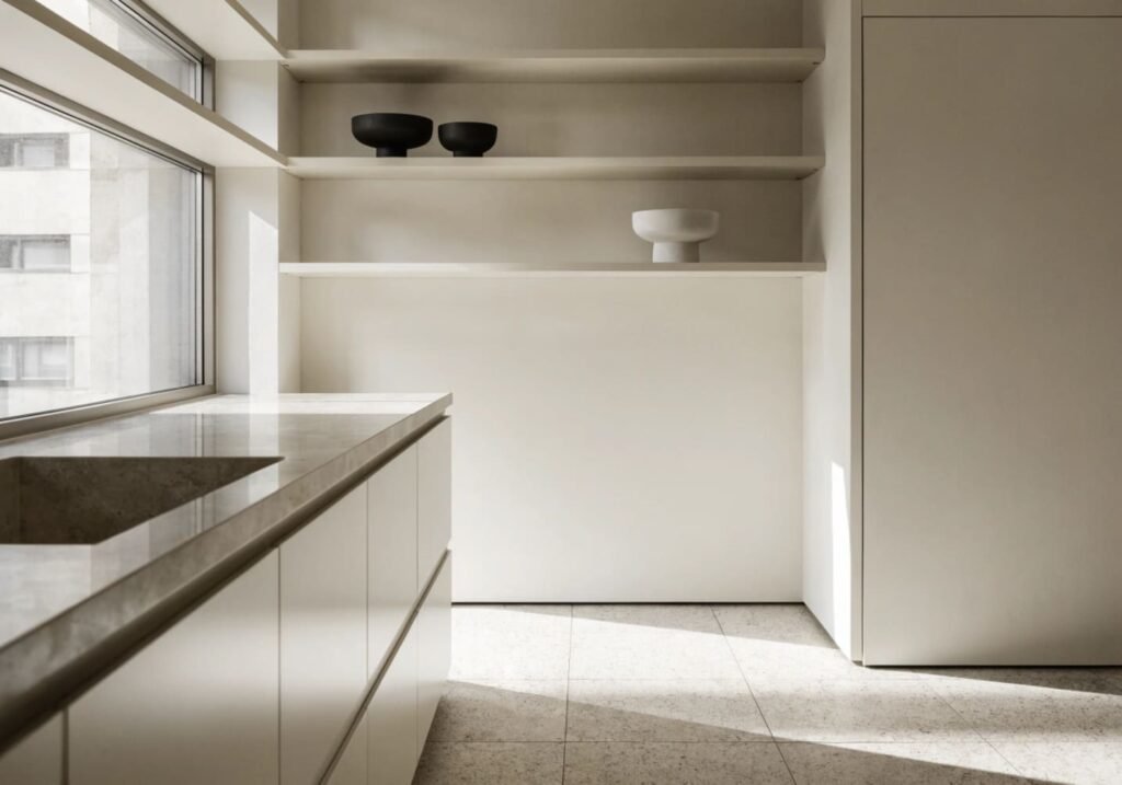 Well-styled open kitchen shelf arrangement with dishes and decor.