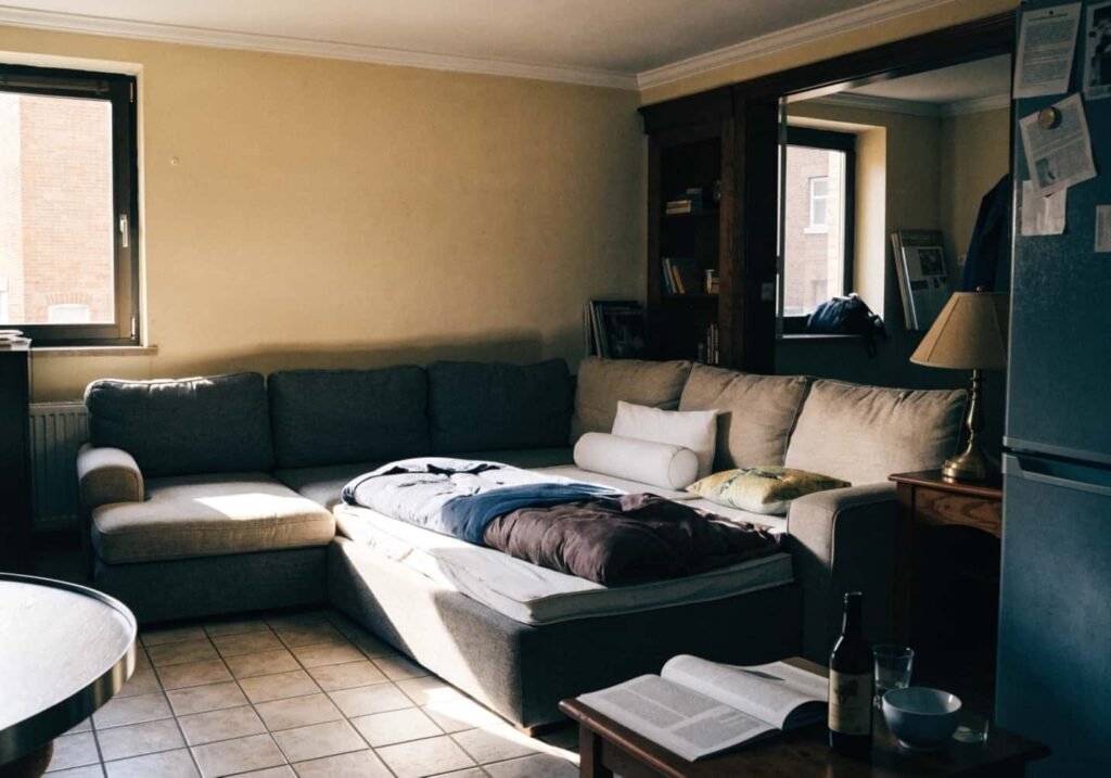 Dual-purpose sectional sofa converted into a guest bed