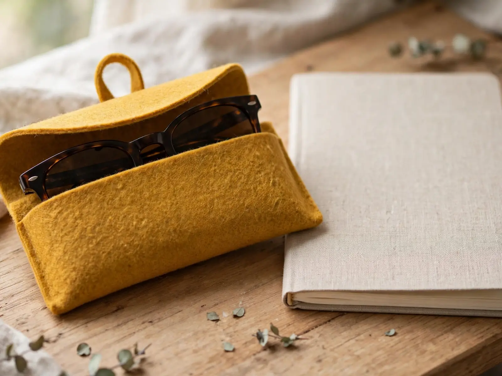 Mustard felt glasses case with sunglasses