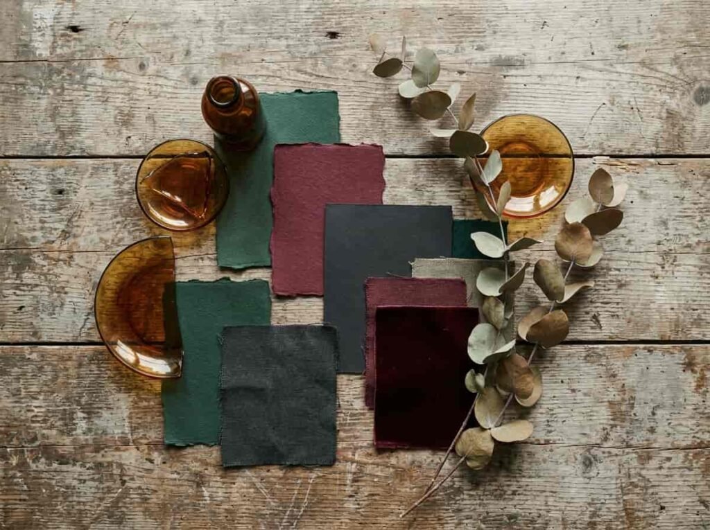 Color palette inspiration of forest green, burgundy, charcoal and amber for witchy apothecary decor