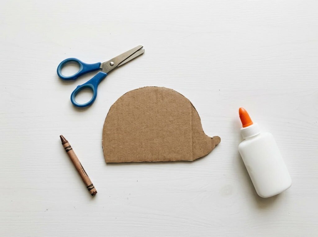 Cardboard hedgehog body cut out and ready for leaf decorating
