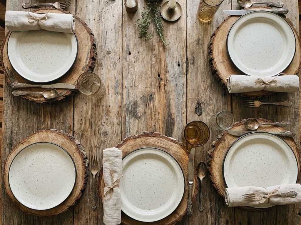Overhead view of a rustic Thanksgiving place setting on a bare reclaimed wood table